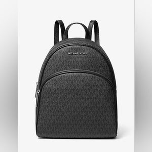 BRAND NEW STILL IN PLASTIC AND BOX MK BLACK BACKPACK